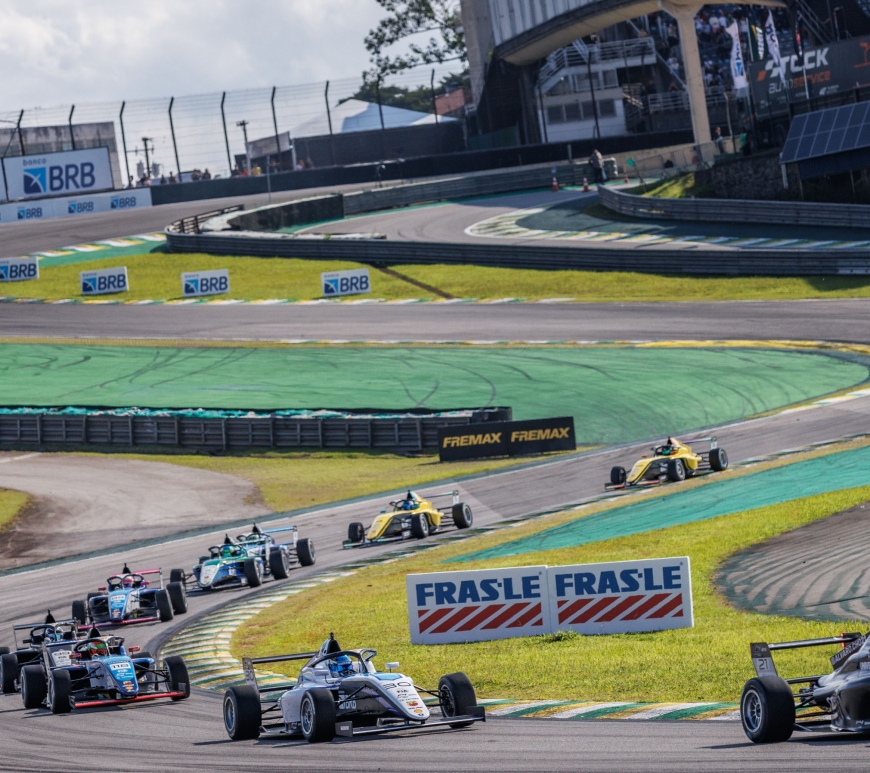 Cars rounding the Senna S at Interlagos, photographed from Turn 3